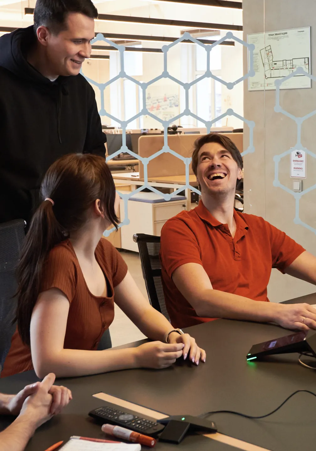 Team members have a happy discussion during an office meeting