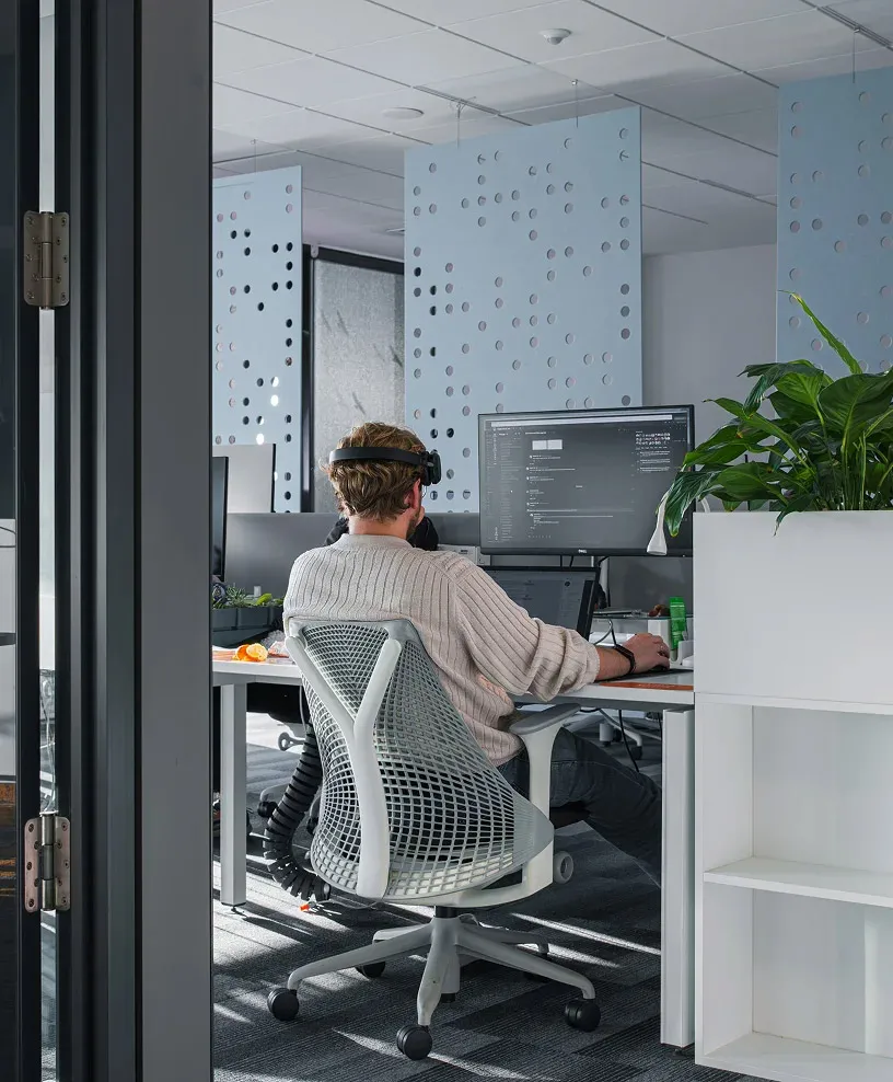 A developer coding on his computer