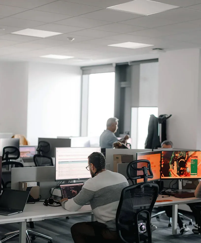 A contact center agent facing a computer