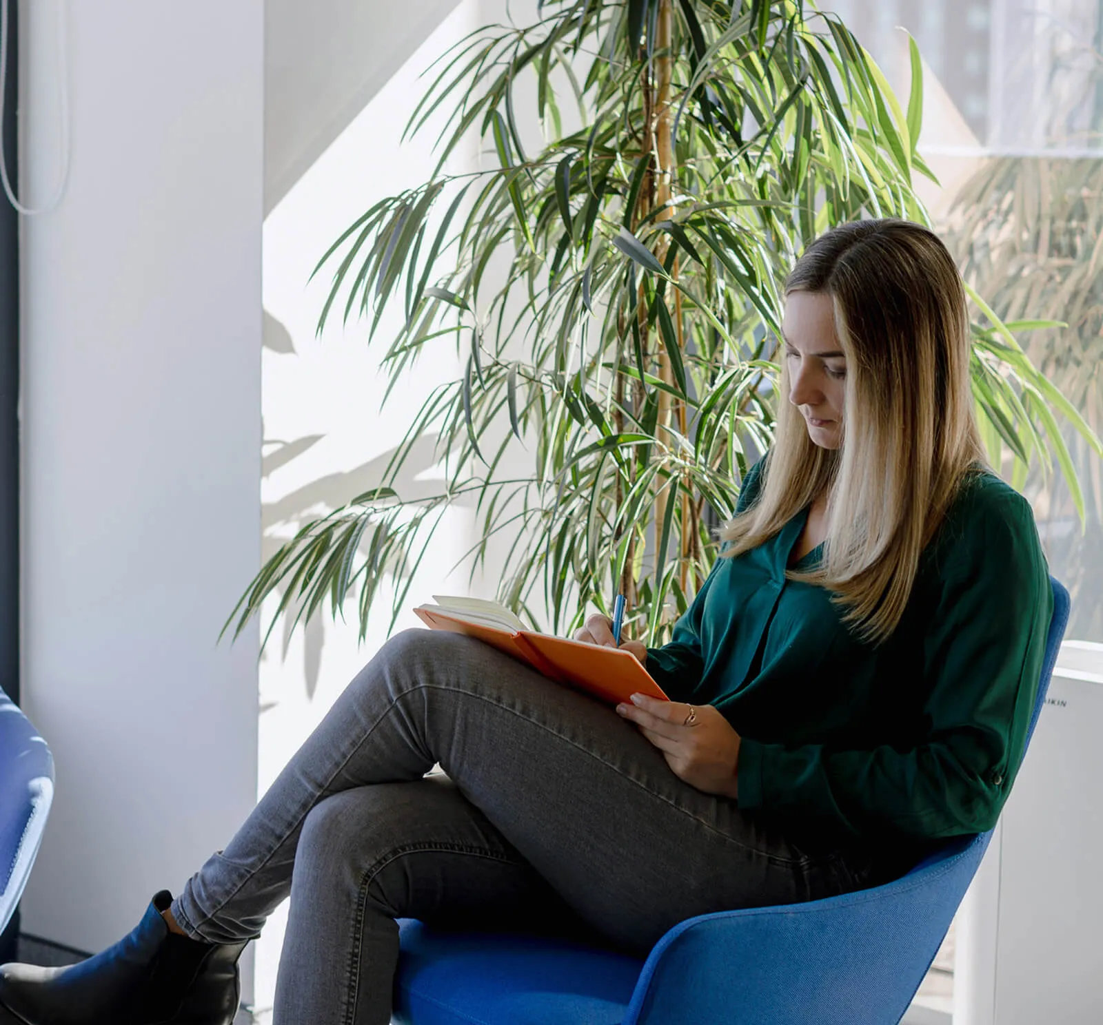 A RingCentral employee lounging while reading