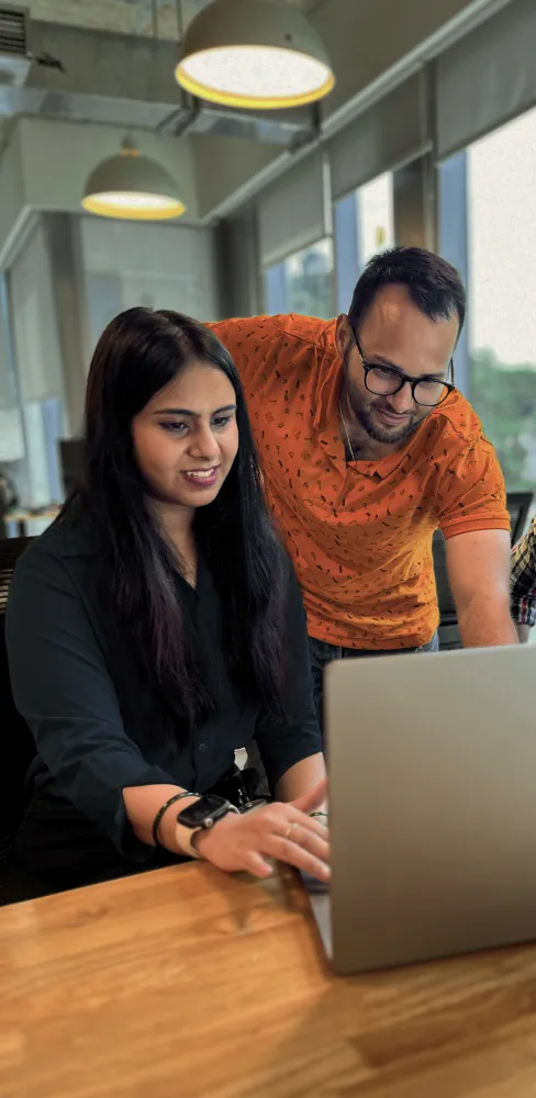 Team members have a happy discussion during an office meeting
