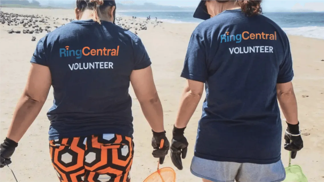 Two RingCentral volunteers participating in a beach clean up
