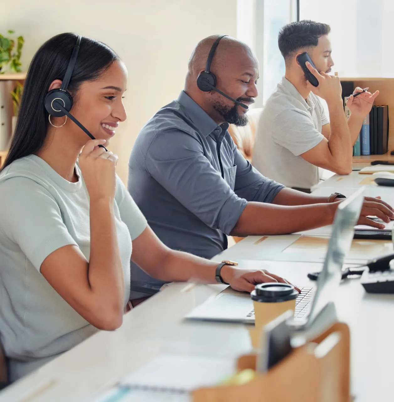 A group of contact center agents providing customer support to callers