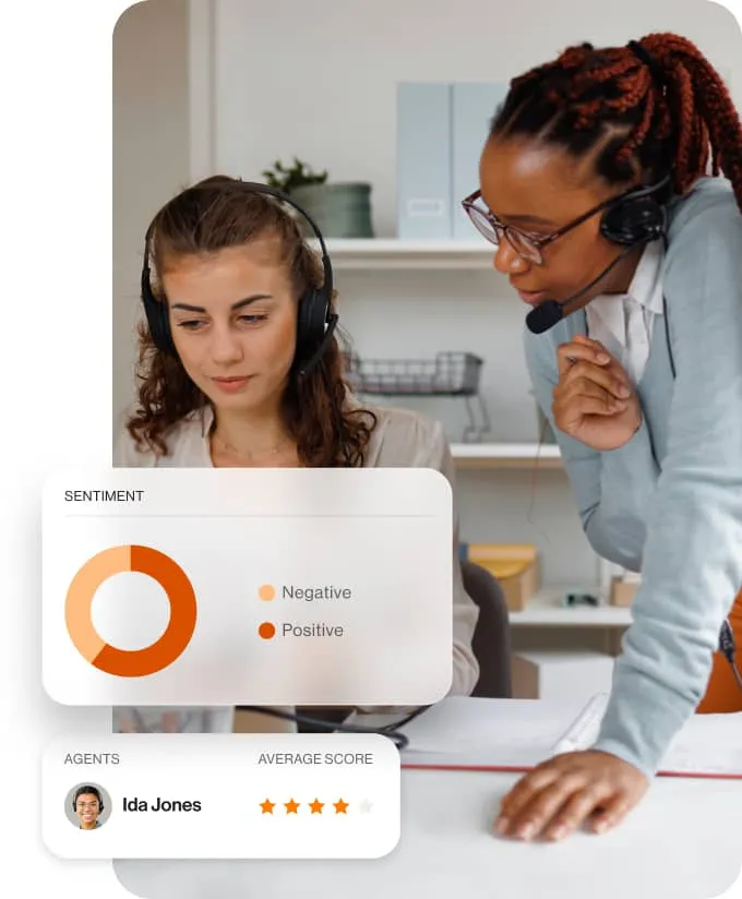 A coaching session between supervisor and agent with a view of the agent's sentiment score