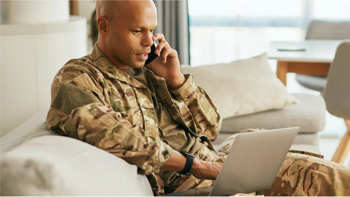 Military male looking at the laptop
