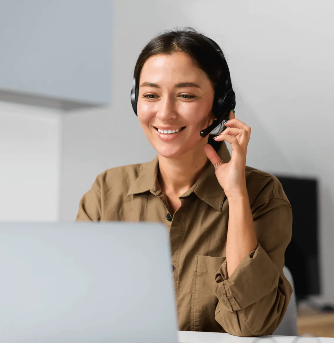 A female talking on a headset while looking at call logs