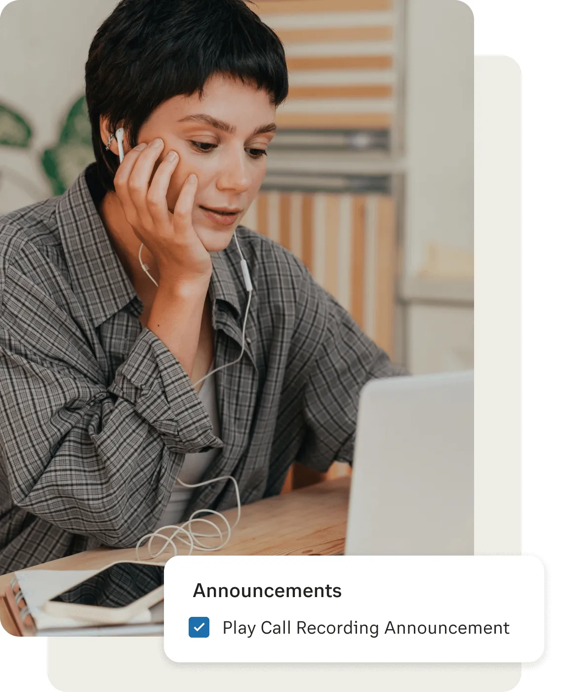 A female on her phone listening to call recordings