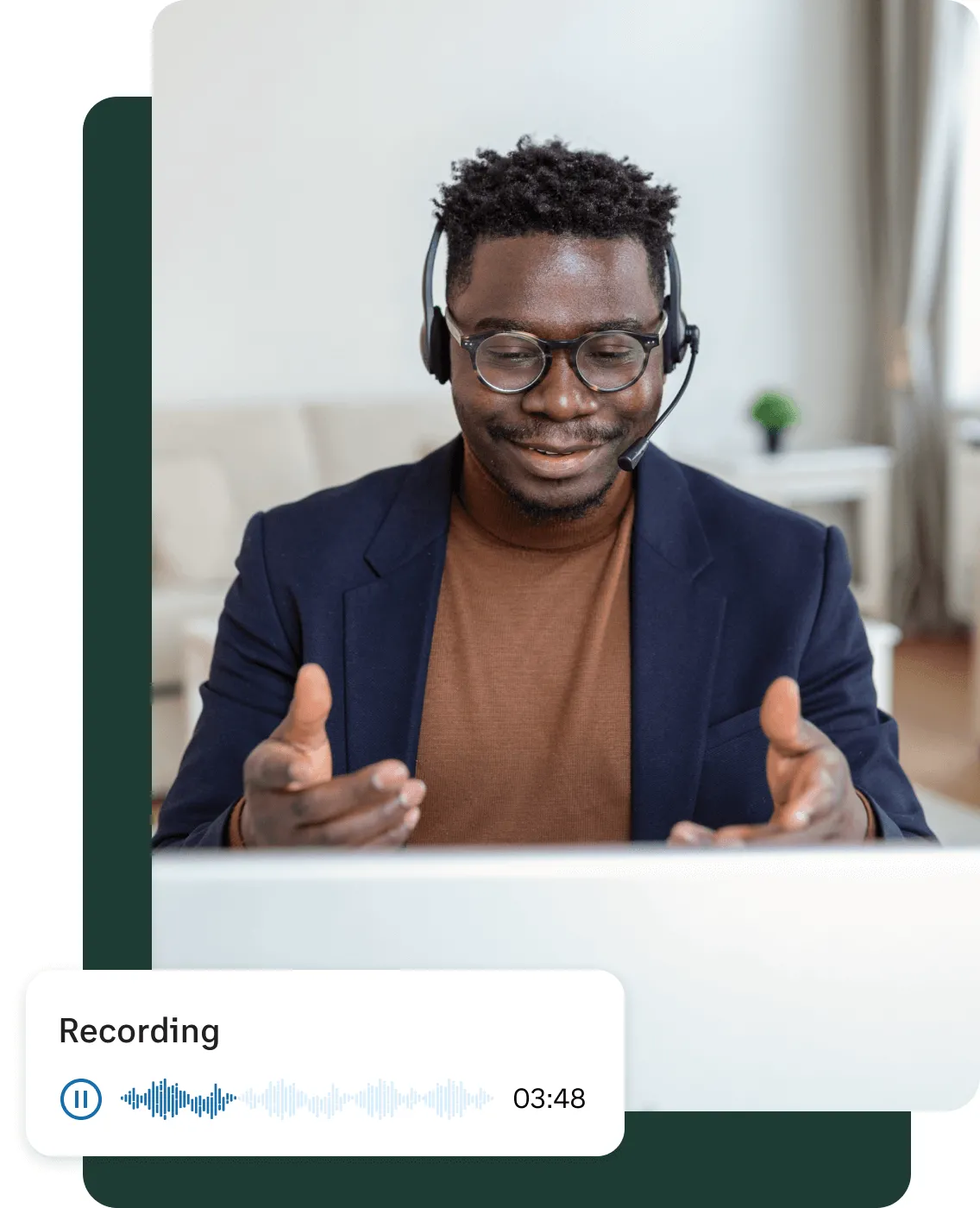 A male on his laptop listening to call recordings