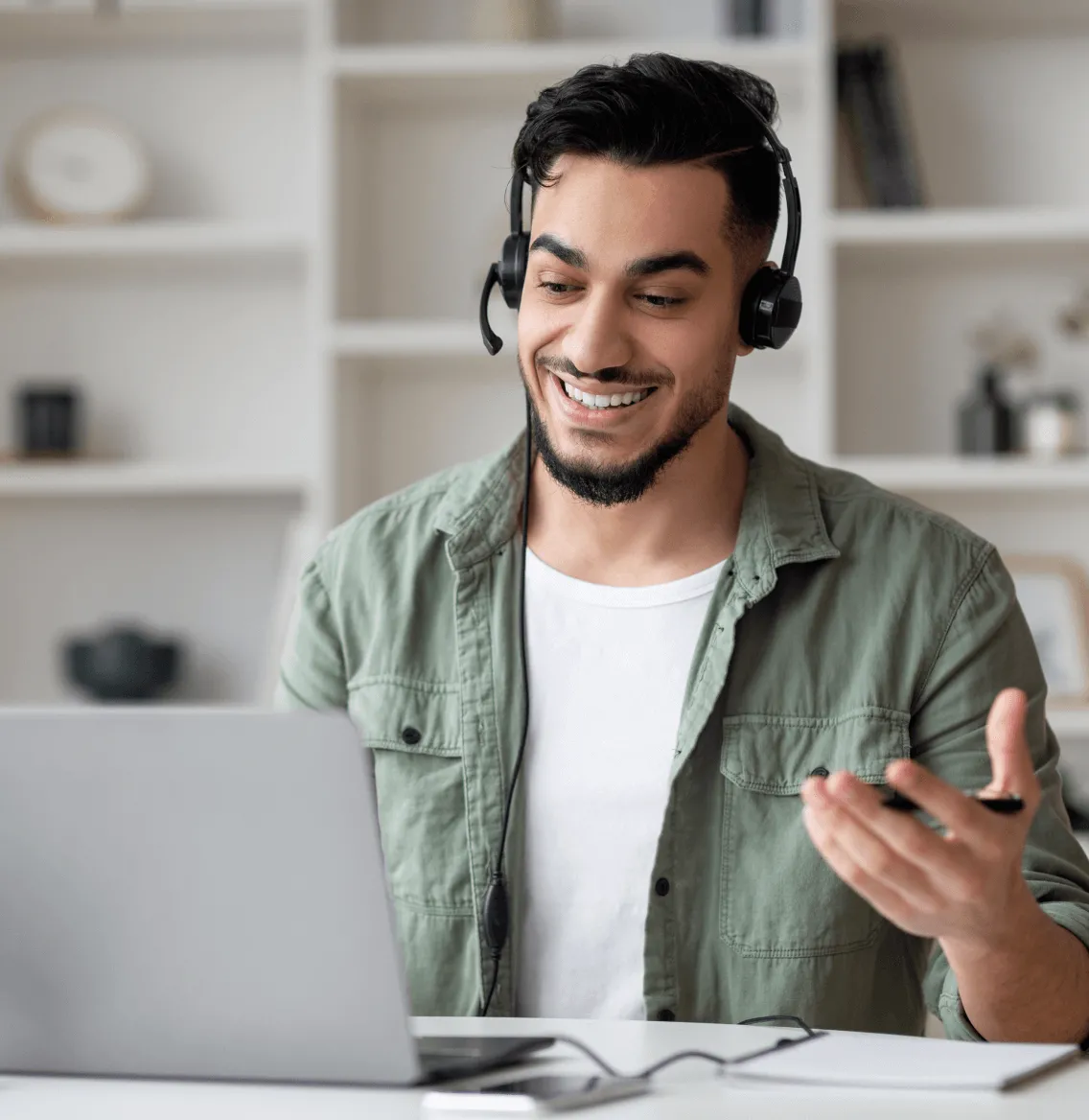 A male talking on a headset while on a call