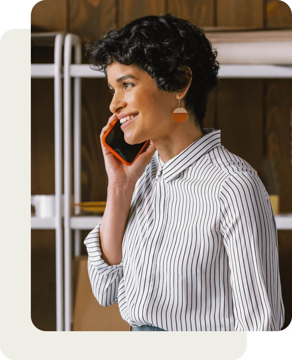 The side profile of a woman on a phone call using her mobile phone