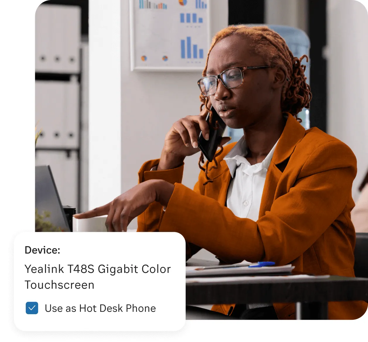 A woman using the Yealink T485 Gigabit color Touchscreen as a Hotdesking device powered by the RingCentral app