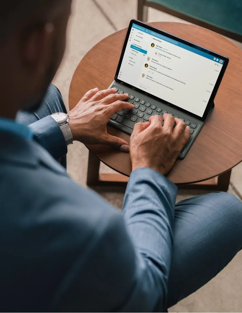 A man collaborates with his team using the RingCentral app on his laptop
