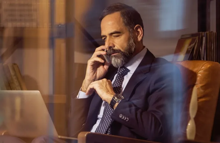 Blog cover: A male executive on a call using his mobile phone