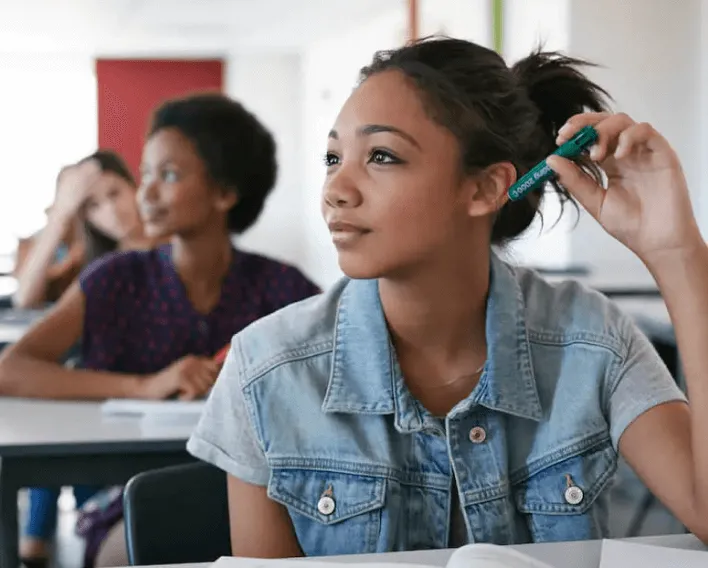 Students intently listening to their teacher