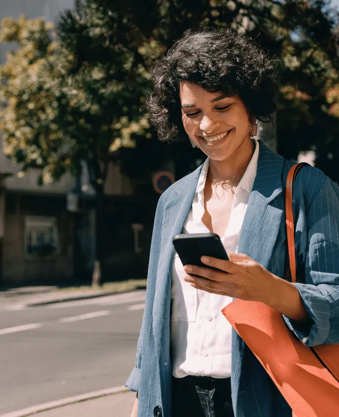 A female consultant looking at her mobile phone with an insert of a list of benefits in using the RingCentral app in a consultancy business