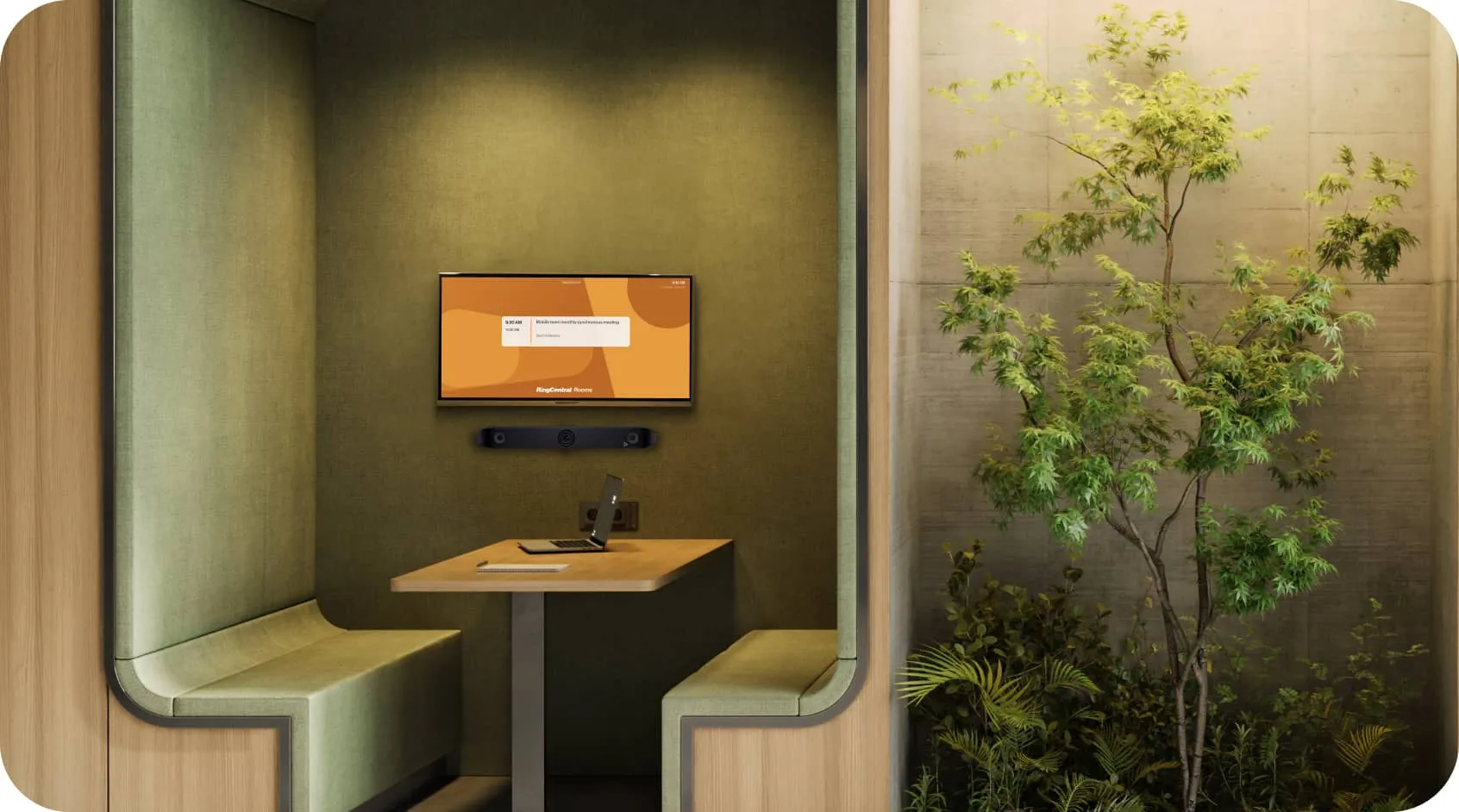 A small meeting room with a laptop on the table