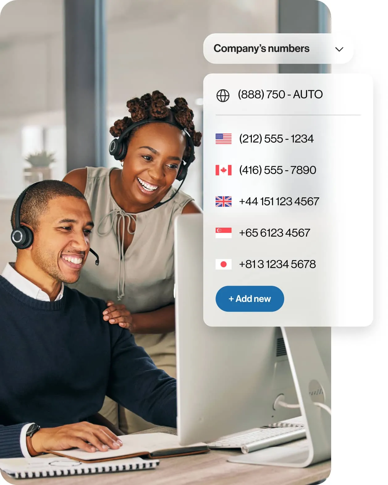 A female supervisor and a male agent looking at a monitor screen with an insert of a list of international business phone numbers provided by RingCentral