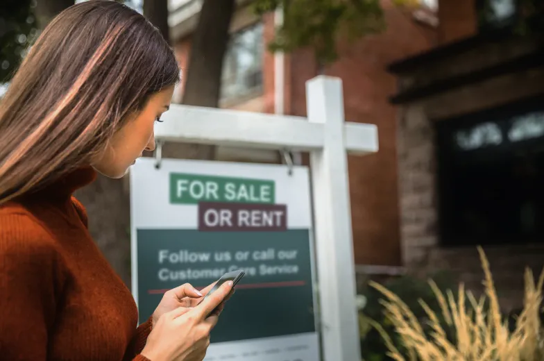 A woman contacts the customer care service to purchase real estate