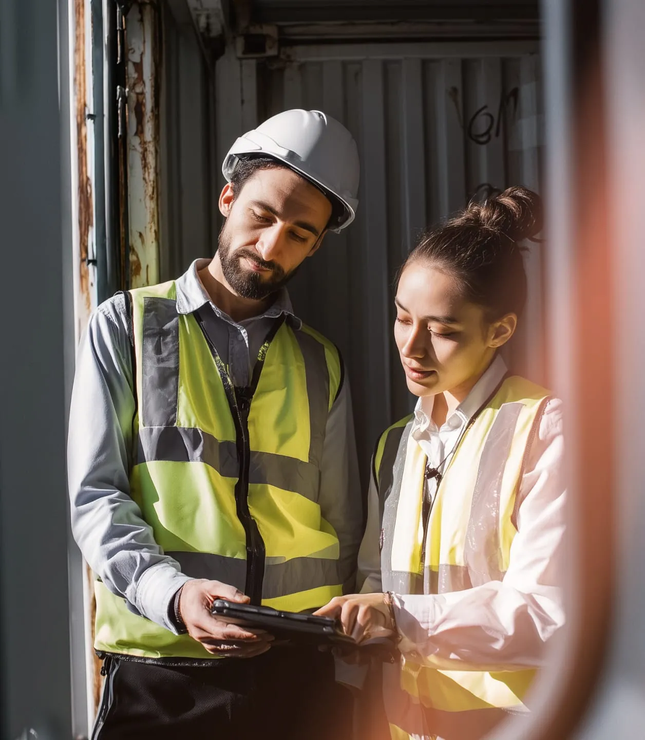 Freight staff member checking notifications on the RingCentral app using a tablet.